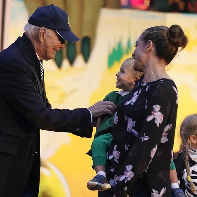 Biden and Jill Biden hand out books and candy while hosting thousands for rainy trick or treating